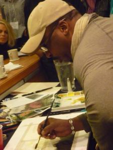 Earl Gradley Lewis demonstrates at the Austin SCBWI conference