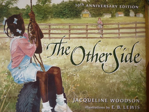The Caldecott Honor winning "The Other Side" by Jacqueline Woodson, illustrated by E.B. Lewis.